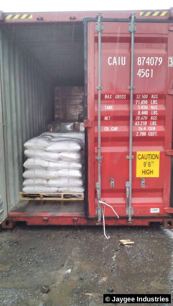 A fully loaded 40-foot high-cube shipping container with Jaygee Industries pallets for export