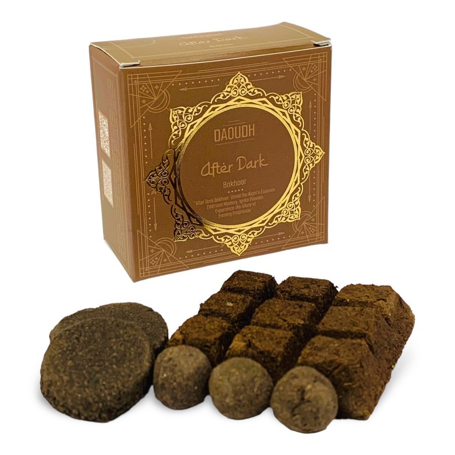 Daoudh After Dark Bakhoor — warm tan gold box with arabesque frame