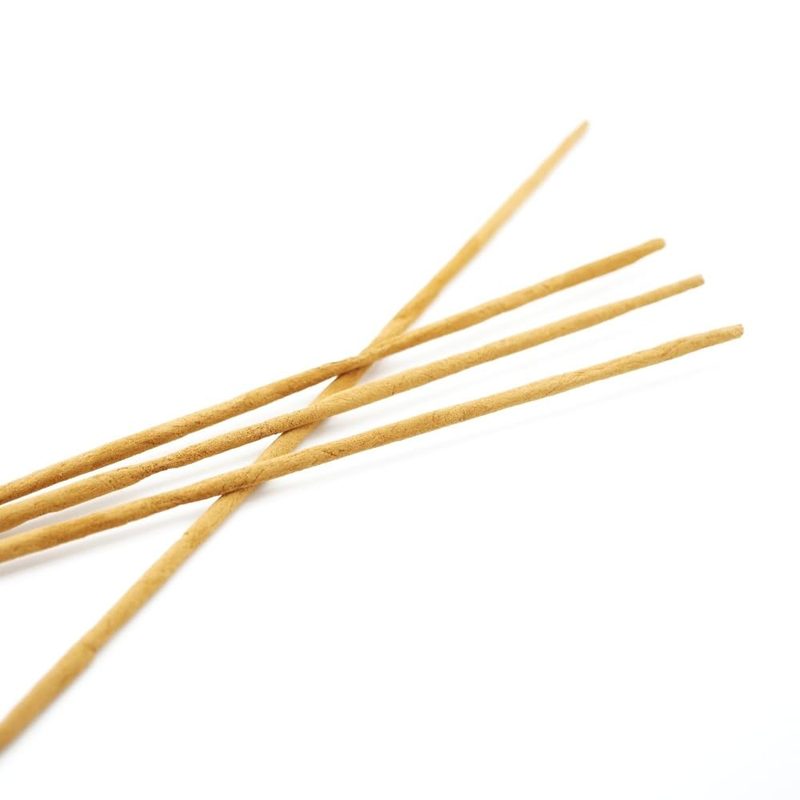 Mother Incense individual incense sticks crossed on white background — natural masala stick detail