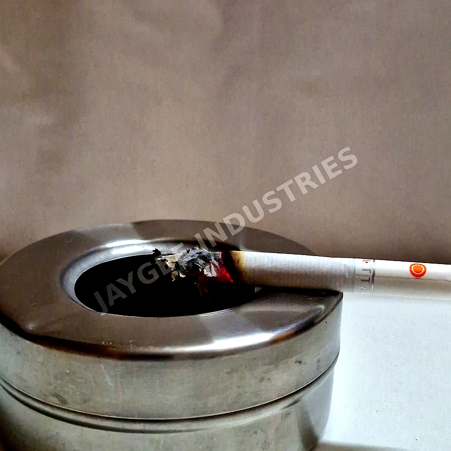 Jaygee Industries cigarette incense stick resting in a stainless steel ashtray — for aromatic use only, not for smoking