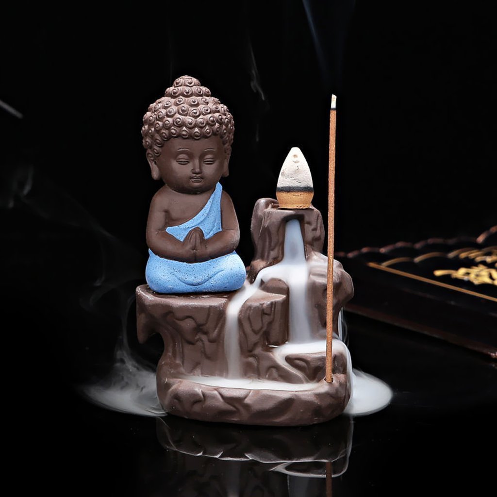 Little Buddha backflow incense burner — smoke cascades downward in a mesmerising waterfall