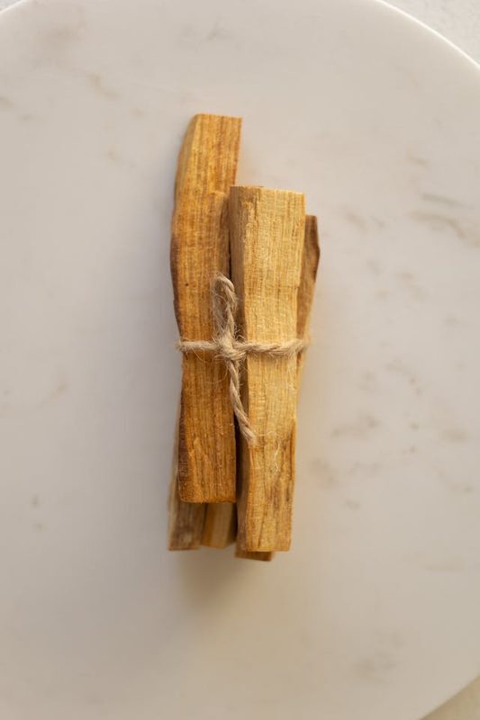 Palo Santo sacred wood sticks in wooden bowl